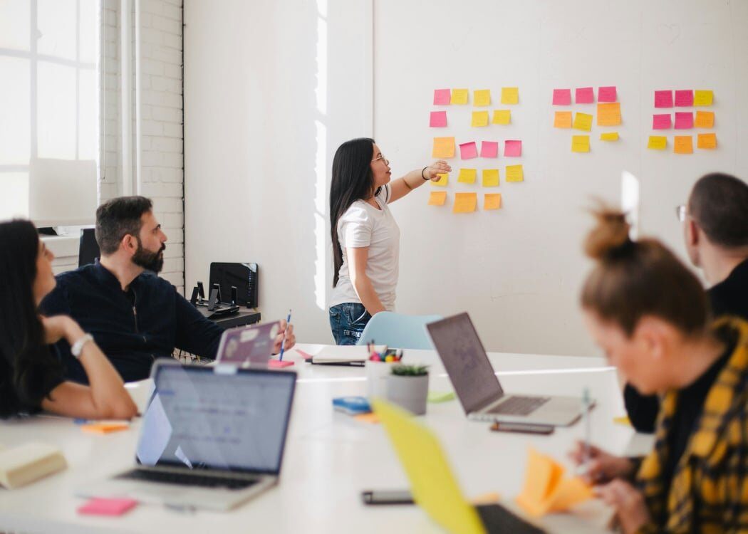 graphic packaging designers sitting at desk in work process